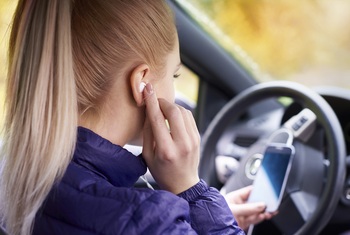 driving with earbuds.jpg